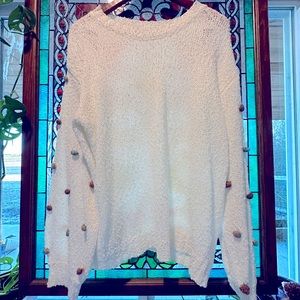 ee:some light knit sweater in white, deep neutral poms on sleeves. size:large